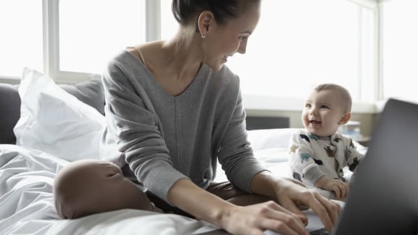 Mother and baby with laptop