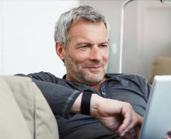 Man sofa tablet