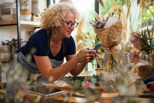 Woman smiling at mobile phone